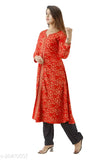 Multi-colored rayon kurti palazz set for women & girls, features printed net design and three-quarter sleeves. Available in sizes S to XXXL from India
