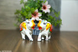 Handcrafted white paper mache elephant figurines, set of 2 for living room decor or gift - perfect for home, office, or temple. Ideal for wedding gifts, anniversaries, or festivals