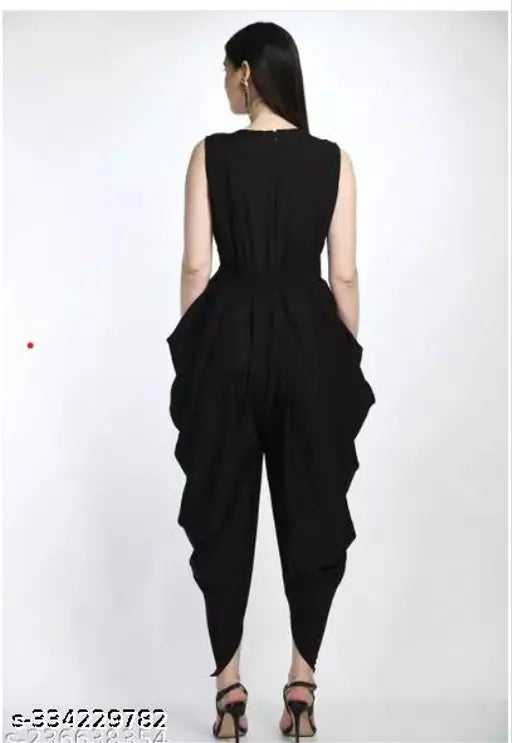 Black crepe dhoti jumpsuit, solid pattern women's fashion, latest printed Indian wear on mannequin