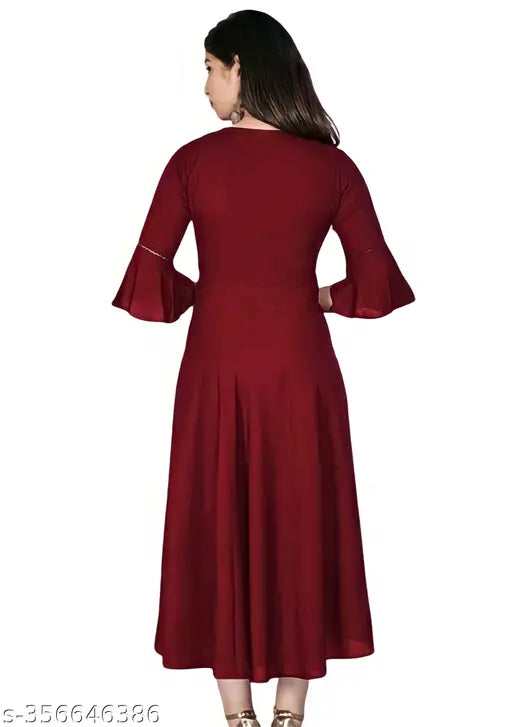 Trendy maroon rayon flared kurtis for women, three-quarter sleeves, solid pattern. Versatile A-line dress transitions from knee to maxi length, comfy lining, India origin