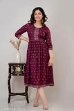 Rayon-cotton women's printed Anarkali Kurta in wine or Firozi color, three-quarter sleeves, formal and casual wear. Printed combo with round neckline and calf length. Includes one kurta. Breathable fabric for comfort in warmer weather. Made in India