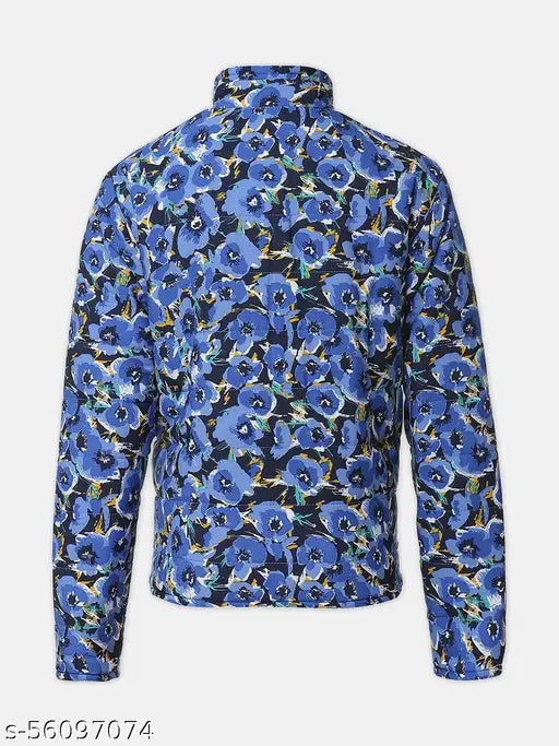 Blue polyester floral print girls jacket with reversible quilted design, long sleeves and zip. Multicolor, all-over floral print on one side, sea green on the other. Perfect for a trendy look for ages 5-14 years. Made in India