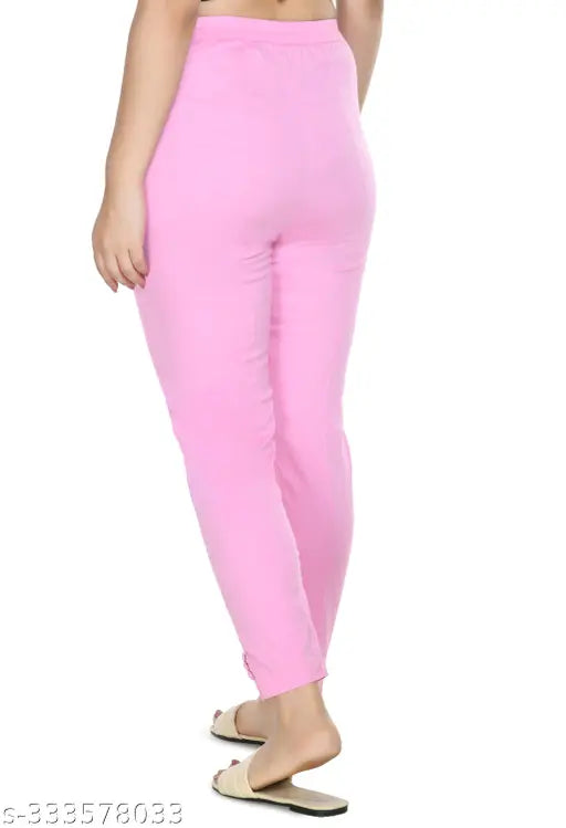 Baby pink solid cropped cigarette trousers by Preego, cotton blend, half elasticated waist for comfort