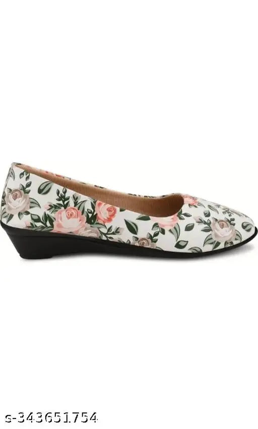 White synthetic slip-on ballerinas from imporio Fashion Hub, featuring printed design and patent leather. Attractive and comfortable for women, available in various sizes (IND-3 to IND-8). Made in India