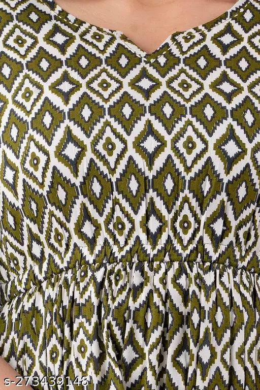 Rayon flared anarkali kurta with tassels, elasticated waistband, slit elbow cut sleeves, and kantha work neckline. Organic rayon fabric, 3/4th sleeve, side pocket, Aztec print design. Handcrafted Indian western dress for casual, party, or function wear