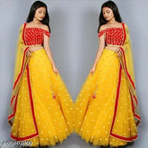 Yellow net lehenga with heavy embroidery and matching blouse, Indian bridal wear on mannequin