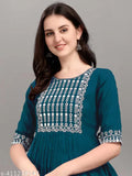 Rayon embroidered kurti, single-toned Indian clothing with three-quarter sleeves, on mannequin for display