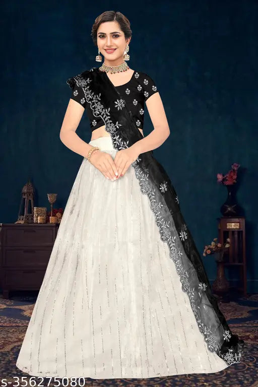 Embroidered heavy net lehenga choli with sequins, dupion silk topwear and net bottomwear, featuring intricate thread work and cutwork dupatta. Indian embroidery design on display