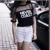 Black cotton crop top with unique Never Coast print and net detail, women's short sleeve, casual wear