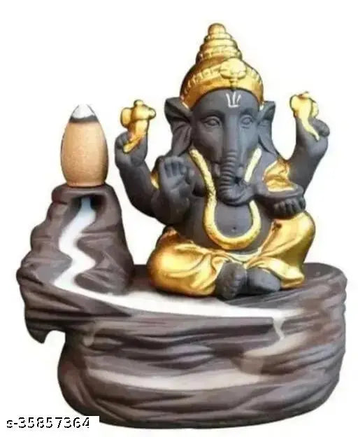 Golden poly resin Ganesh smoke fountain with 10 free sent cones, traditional Indian idol on display