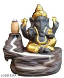 Golden poly resin Ganesh smoke fountain with 10 free sent cones, traditional Indian idol on display