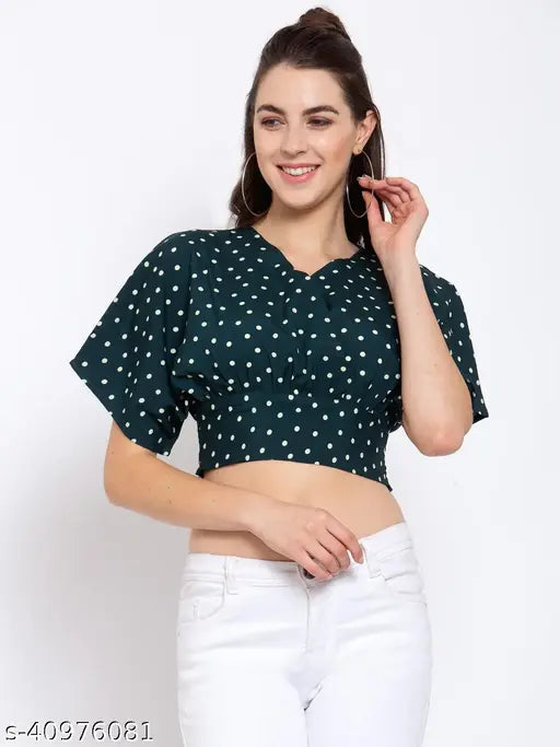 Green and white polka dot printed crepe regular crop top on model, women's size M (bust 36in, length 18in), made of polyester