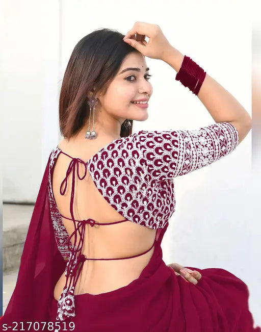 Maroon Georgette dyed sequence embroidery women's saree, embellished net blouse on display stand, perfect for Indian family events