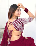 Maroon Georgette dyed sequence embroidery women's saree, embellished net blouse on display stand, perfect for Indian family events