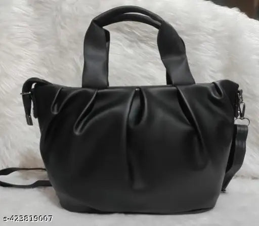 Black faux leather sling bag with adjustable strap, Chunnat pattern for women and girls. Solid net construction, free size, made in India