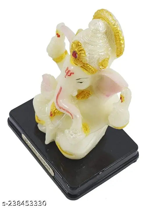 Handcrafted poly resin Kaan Ganesha Idol, embellished with leafing goldwork. Exquisite home decor or gifting option, perfect for special occasions like Diwali, Raksha Bandhan, or wedding gifts