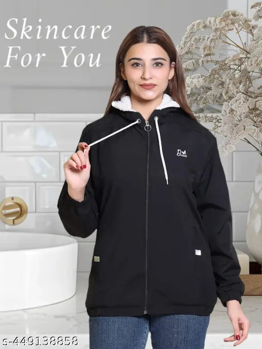 Women's polyester full-sleeve winter windcheater jacket with self-design, regular fit and trendy look. Close-up of jacket on model outdoors in snow