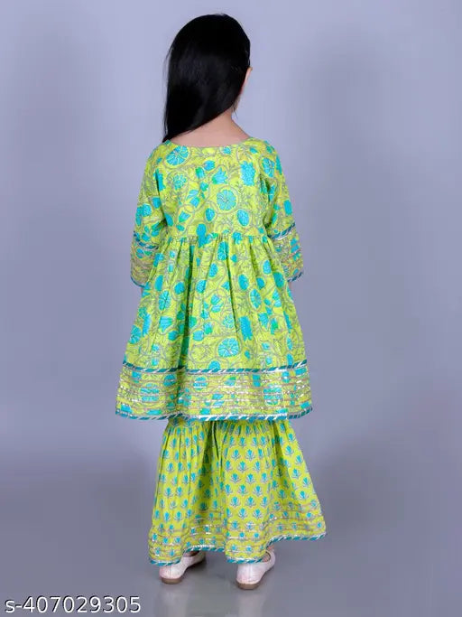 Lime green cotton floral print Anarkali/Flared Kurta & Sharara Set for girls. Soft, breathable, and comfortable clothing set with three-quarter sleeves. Perfect casual wear in various sizes (2yrs-14yrs). Made in India