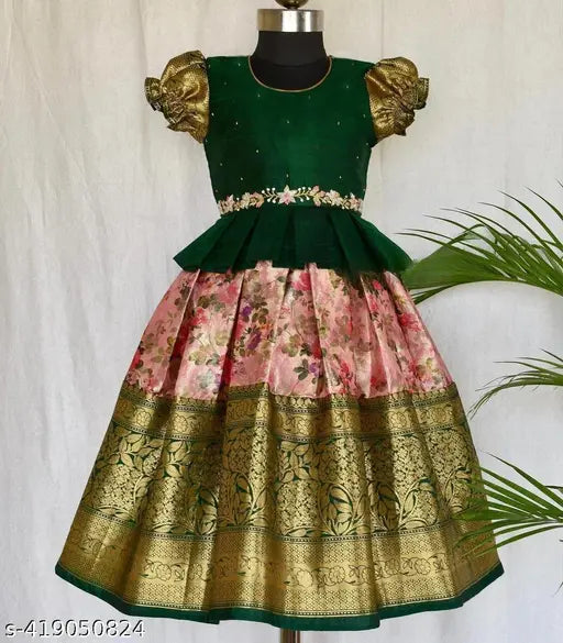 Soft silk kids' South Indian Lehnga Choli with ruffle pattern and puff sleeves, botanical print on jacquard fabric for traditional ethnic wear. Available in various sizes from 12-13 years. Made in India