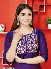 Purple art silk embroidered kurti with three-quarter sleeves, Indian traditional wear on mannequin