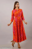 Women's rayon flared printed orange kurti with three-quarter sleeves, made by M K Creation. Available in sizes S to XXL (S: Bust 36in, M: Bust 38in, L: Bust 40in, XL: Bust 42in, XXL: Bust 44in). Made in India