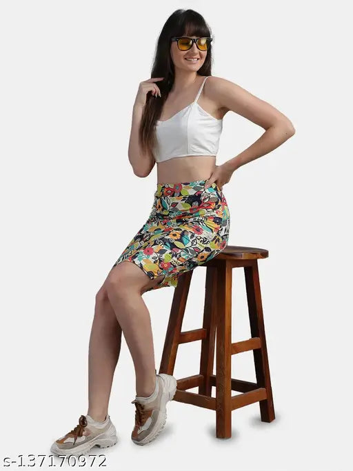 Green polyester leaf-printed pencil skirt for casual wear, designed to match tops by Stylecamp. Perfect for a vintage-style or off shoulder look. Size 30 (waist 30in, length 17in, hip 38in). Made in India