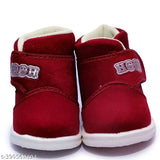 Red canvas and rubber textured Chu-chu sound kids shoes, perfect for little ones' night outings