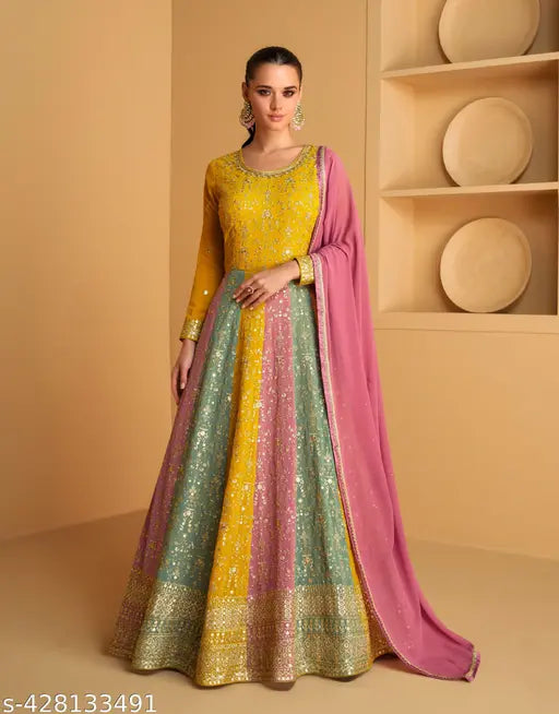 Yellow, green, and pink embroidered Georgette gown with Shantoon inner and pink dupatta. Indian ethnic dress for any occasion
