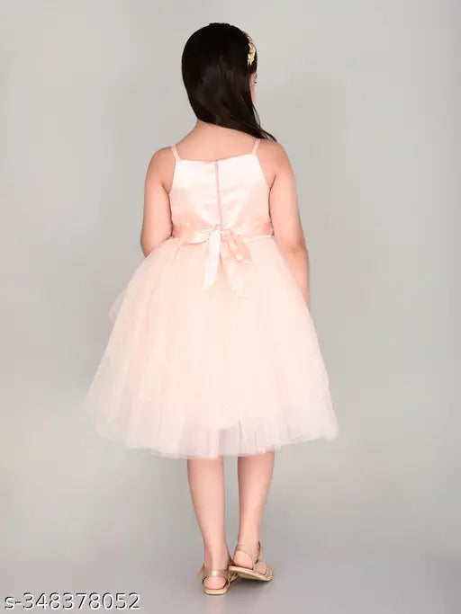Light peach net knee-length party dress for girls, embellished and sleeveless