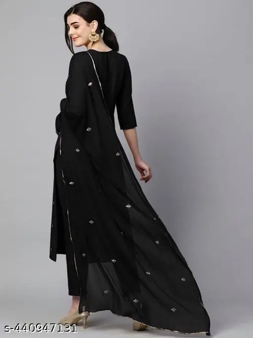 Black cotton blend printed straight kurta set with dupatta and bottomwear, embellished and stitched net fabric on model