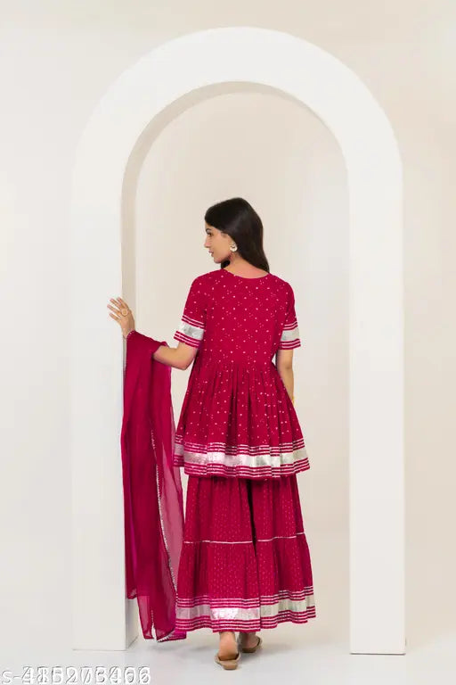 Starry Red Trending Sharara Set: Rayon kurta, sharara bottoms, dupatta set with short sleeves, stitched net fabric. Indian ethnic ensemble for multiple stylish looks