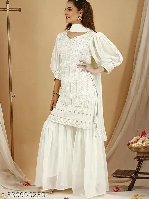 Georgette women's side tie-up kurta sharara set with puffed sleeves and sequin embellishments. Single set includes matching flared pants and dupatta. India-made