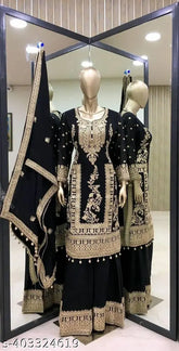 Black cotton silk Kurta with embroidered long sleeves, paired with matching plazzo and dupatta. Indian hand-embroidered traditional attire