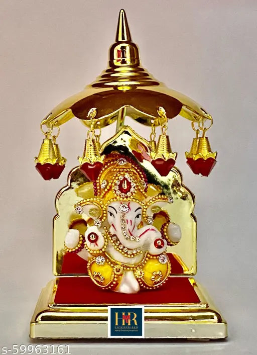 Multi-colored handcrafted Ganesha idol for home decor, ideal for living room and car dashboard. Polyresin material, elegant gift or showpiece for Diwali or housewarming ceremony. Indian origin