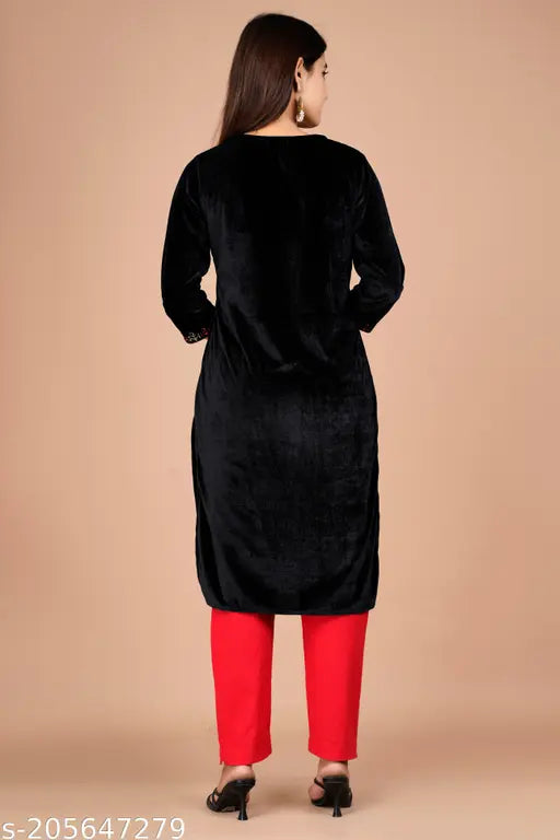 Black velvet winter kurta with ethnic embroidery, three-quarter sleeves. Women's Indian woolen fashion