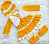 Handcrafted acrylic baby girl woolen frock/sweater with cap and booties in vibrant yellow and white, featuring intricate crochet patterns and scalloped trims. Perfect for special occasions or everyday wear, sizes 6-12 months, 9-12 months, 12-18 months. Made in India