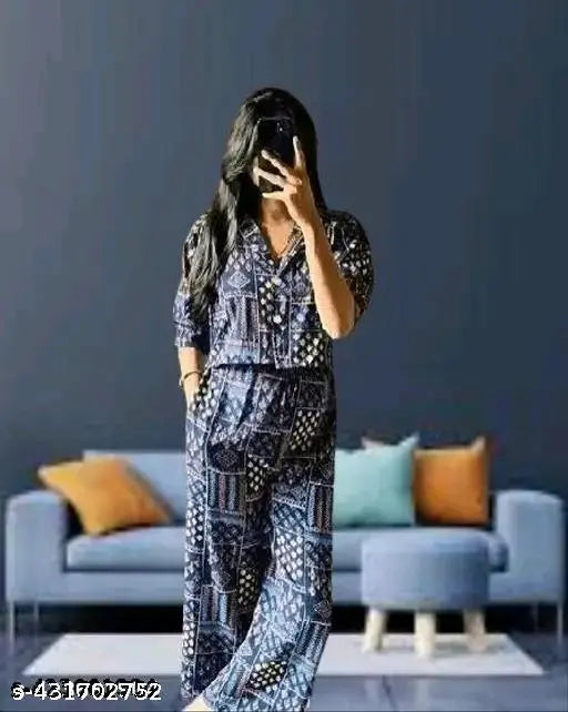 Printed polyester cord set for women, three-quarter sleeves, available in S, M, L, XL, XXL sizes. Indian-made fashion accessory on mannequin