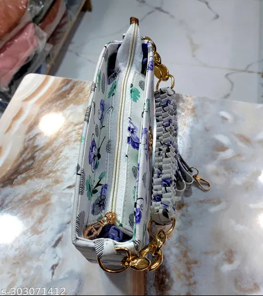 Stylish polyester floral sling bag for women and girls, handmade knitted handle. Quality product at a great price." (125 characters)