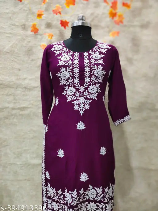 Designer slub rayon embroidered net kurta & plazzo set, three-quarter sleeves, Indian chikankari work on display