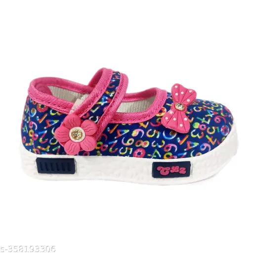 Pink polyester and PVC ballet flat for kids (ages 14 years), vibrant design, easy Velcro closure, suitable for various activities, perfect fit with size chart." (90 characters)