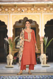 Red printed cotton blend straight kurta with palazzo and dupatta, featuring three-quarter sleeves and solid net pattern. Indian women's fashion attire on display