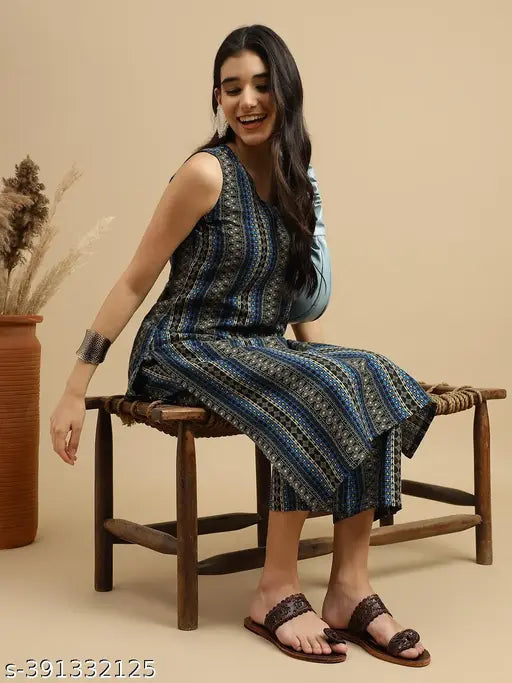 White rayon women's A-line kurta and pant set with stripe print, showcasing traditional Indian craftsmanship