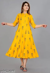 Yellow rayon printed Aline kurti with three-quarter sleeves, vibrant pattern suitable for various bottoms. Indian made women's fashion