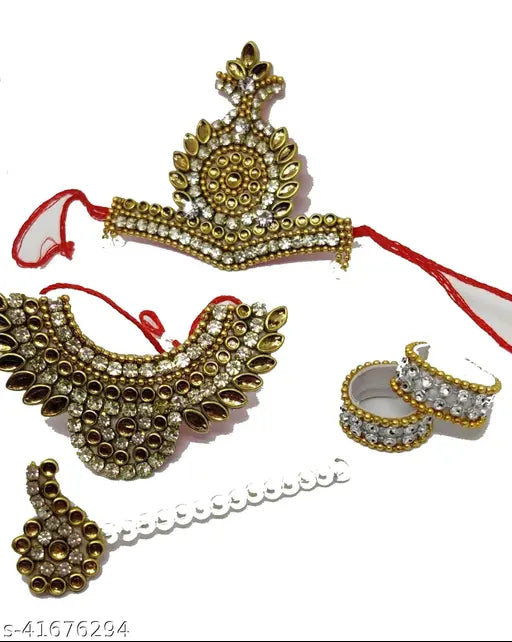 Gold-toned Futurez Key Laddu Gopal Handmade Jewelry Set, featuring necklace, mukut, bangles, and flute (45 size). Ornate with imitation gems, diamonds, and decorative stones. Indian-crafted God idol jewelry set for deities, available in various colors to match dresses