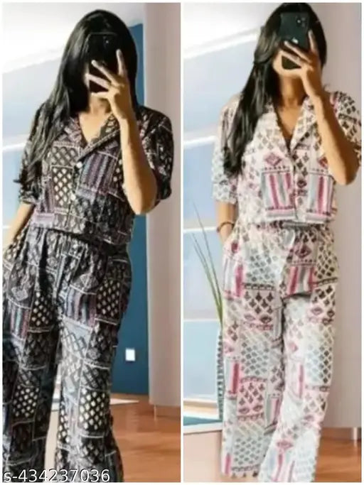 Women's rayon jumpsuit combo with printed net pattern, three-quarter sleeves on display rack, featuring sizes XS, S, M, L, and XL