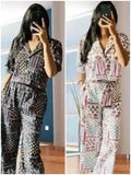 Women's rayon jumpsuit combo with printed net pattern, three-quarter sleeves on display rack, featuring sizes XS, S, M, L, and XL
