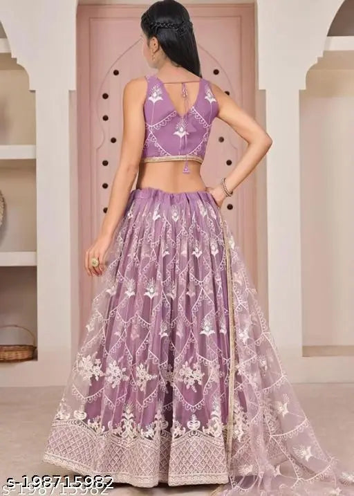 Semi-stitched ethnic wear lehenga, choli and dupatta set in net fabric, embellished with Indian embroidery, for girls aged 6-14 years. Dry clean only