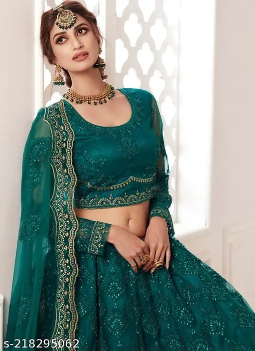 Designer trendy net Lehenga Choli with embroidered stonework and threadwork. Embroidered Indian bridal outfit on mannequin