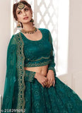 Designer trendy net Lehenga Choli with embroidered stonework and threadwork. Embroidered Indian bridal outfit on mannequin