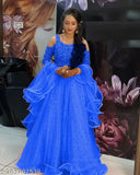 Velvet-embellished morpeach net lehenga choli for Indian weddings. Semi-stitched with 44 inch waist and 44 inch length. Net dupatta included